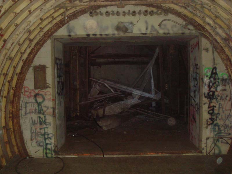 Looking into the entry portal.  The pile of junk is where the elevator was once located.